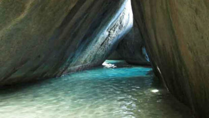 A cave with water flowing through it.