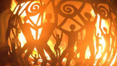 Iron art work with fire inside.