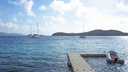 A boat docked at a dock in the water.