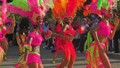 A group of dancers dressed in brightly colored costumes.