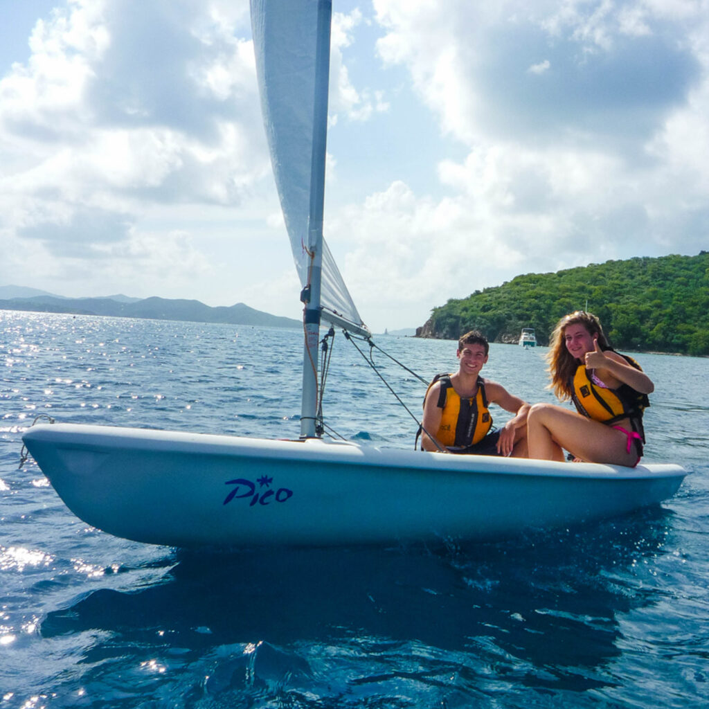 Two women on a sailboat.