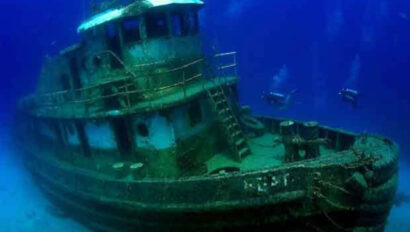 A shipwrecked boat under water.