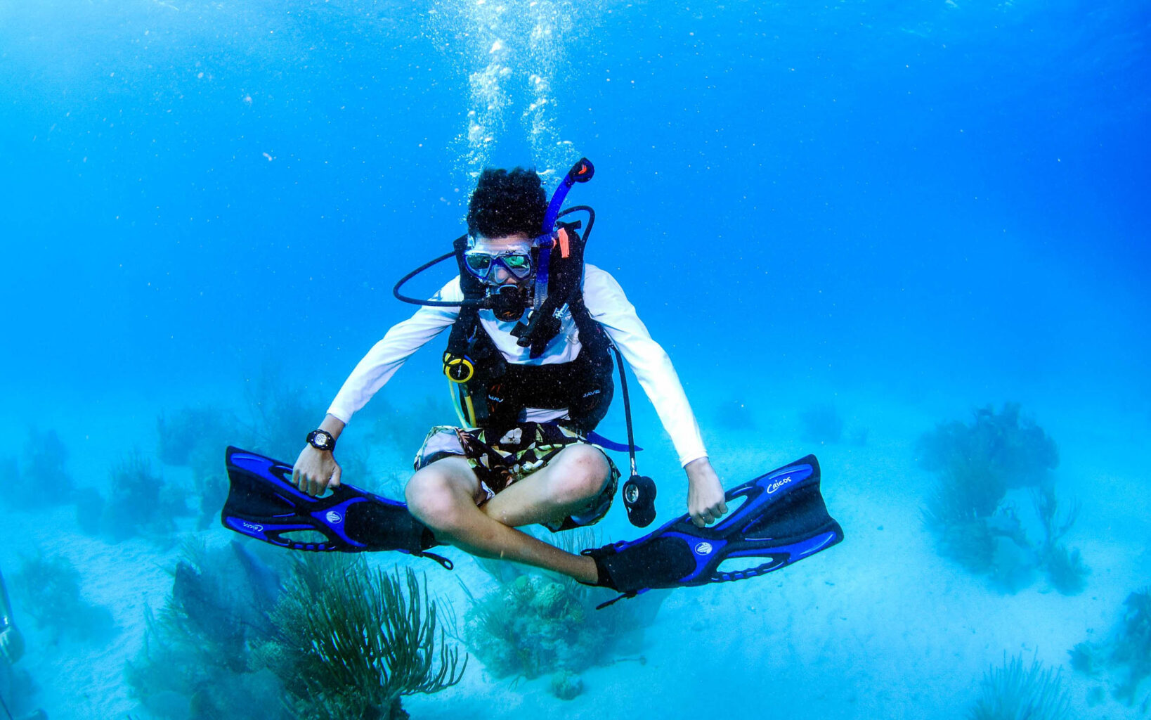 A woman scuba diving in the ocean.