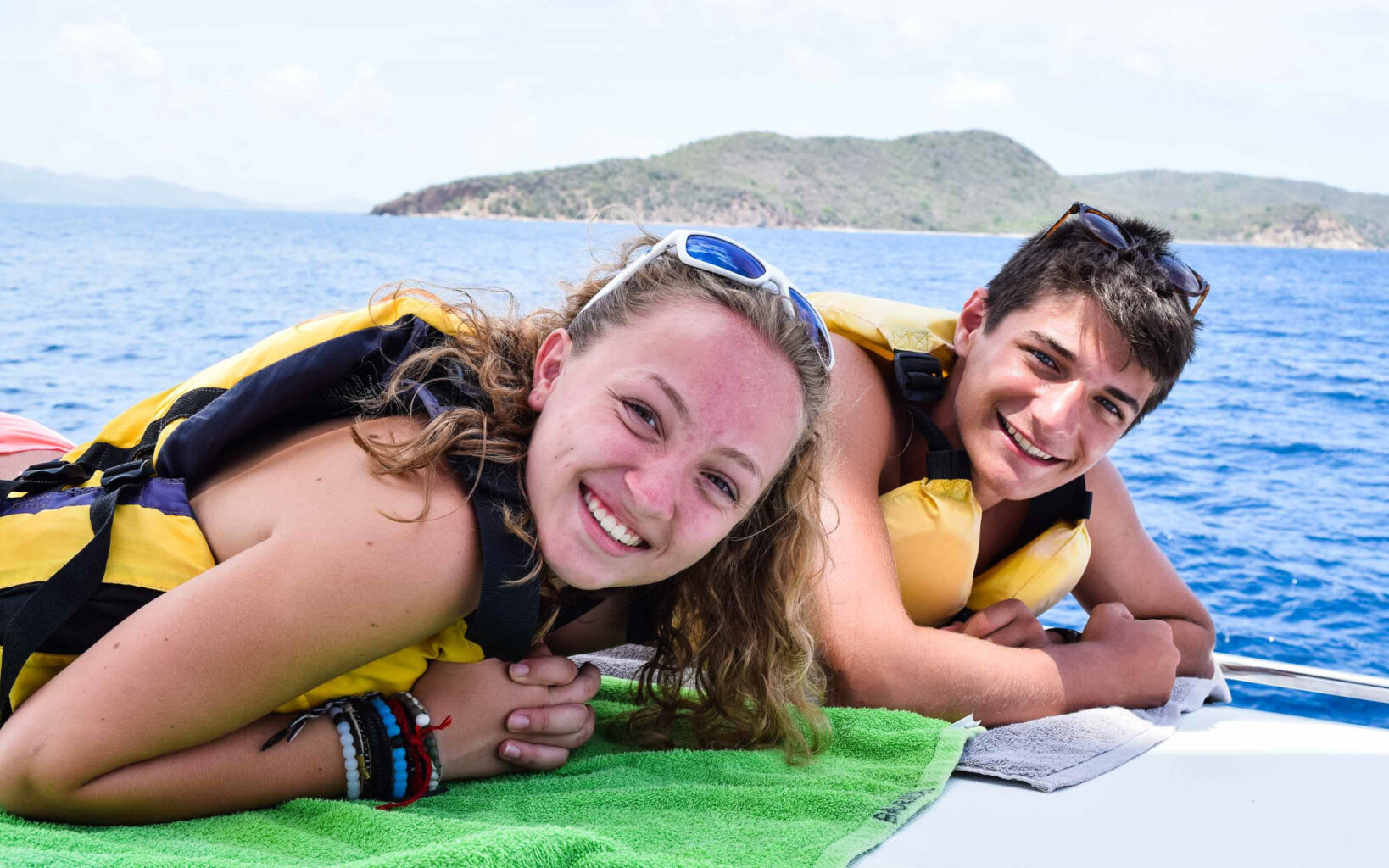 Two people on a boat posing for a photo.