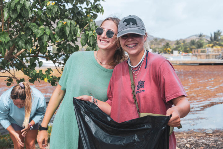 Two women smiling at the camera.