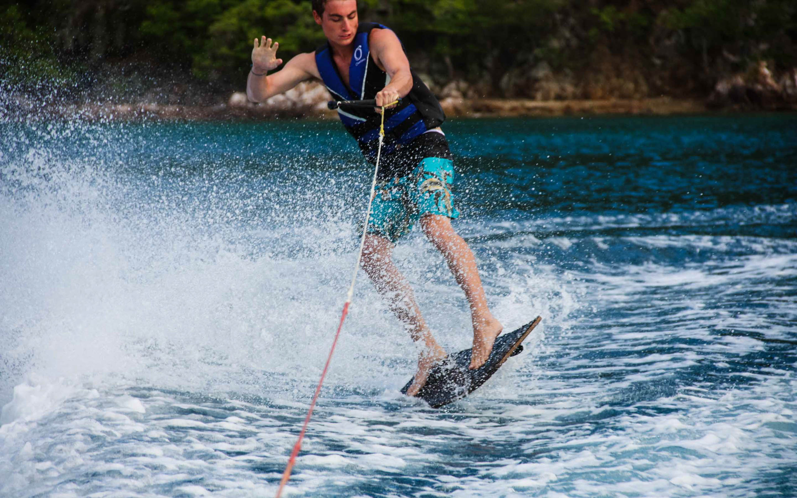 A man is water skiing on a lake.