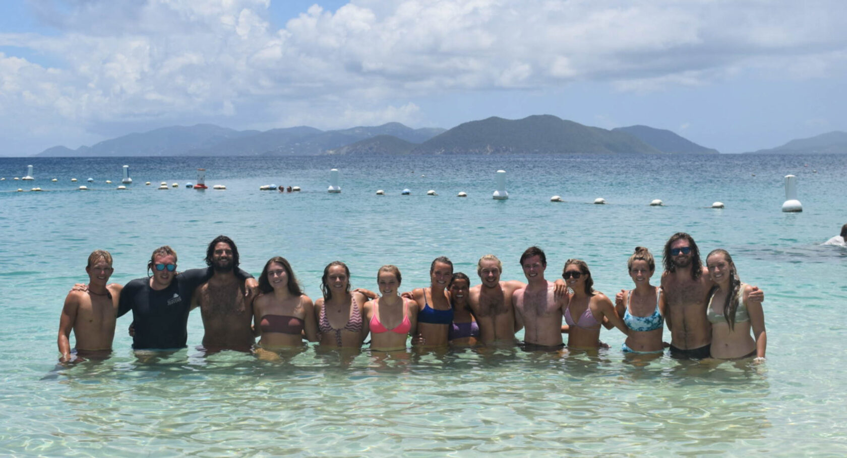 Group photo of some workers in the water.