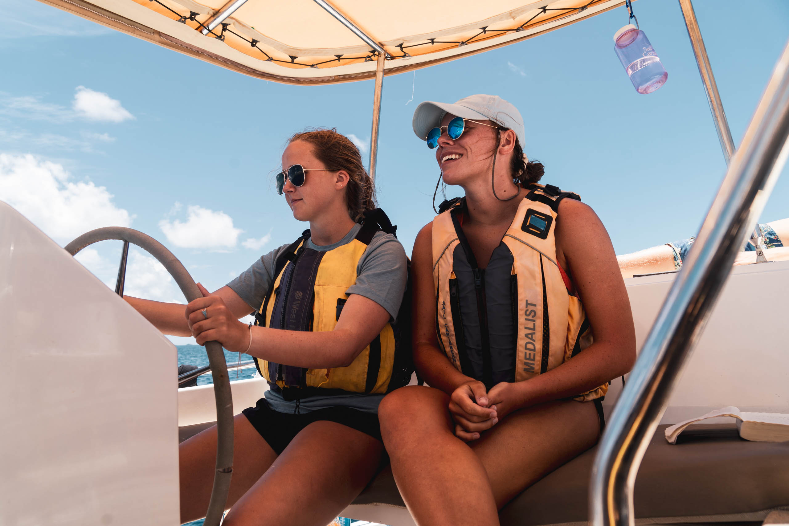 Campers driving the sail boat.