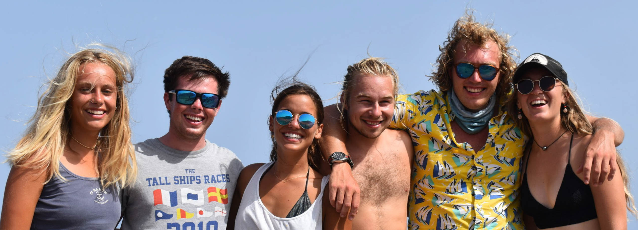 Group of staff smiling together for a photo.