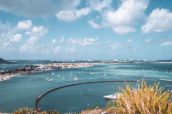 A view of a bay with boats docked in it.