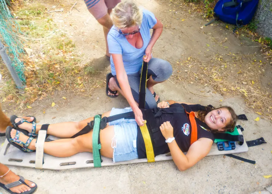 Instructor demonstrating how to use a stretcher.