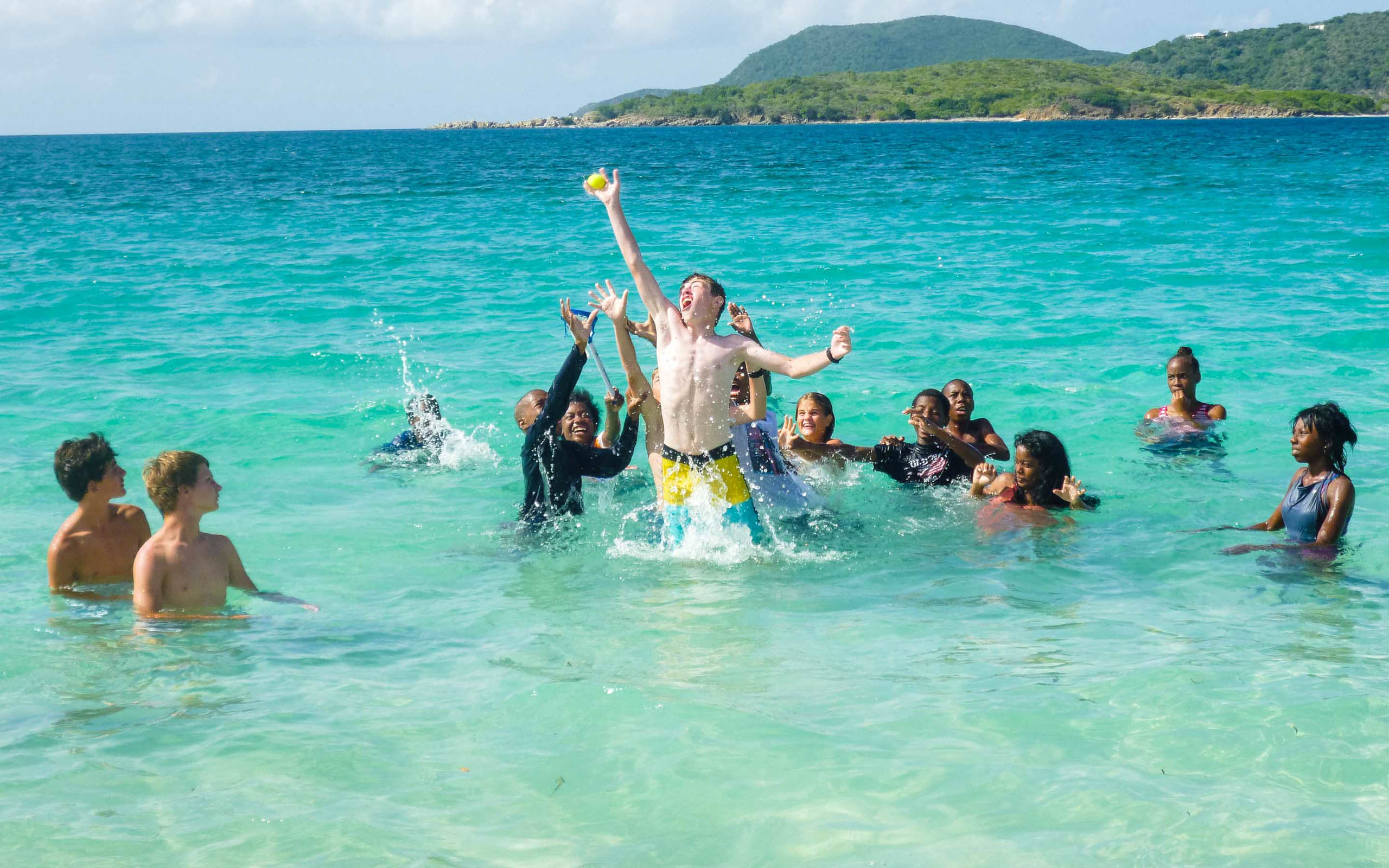 A group of people in the water.