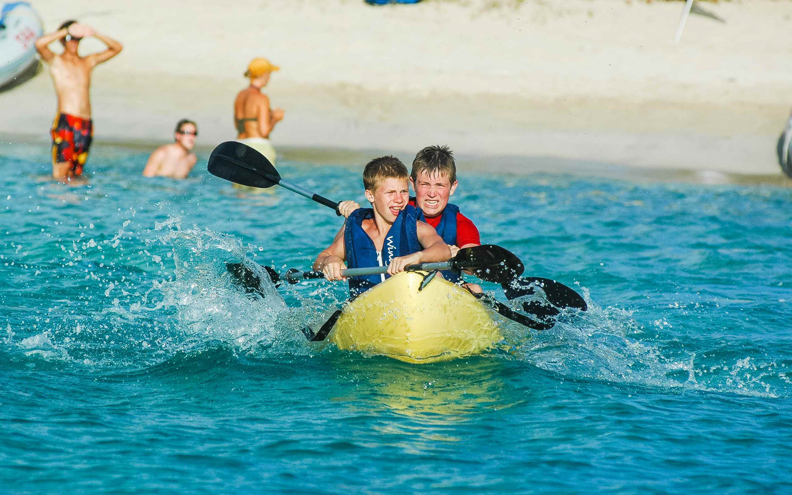 Two boys in a kayak.