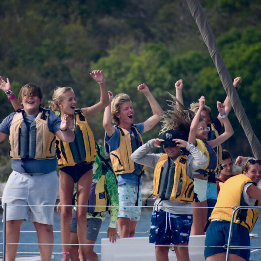 Campers having fun on a boat.