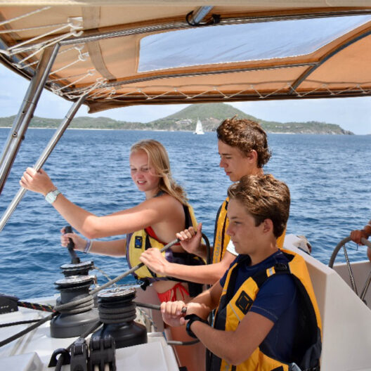 Campers driving a small boat.