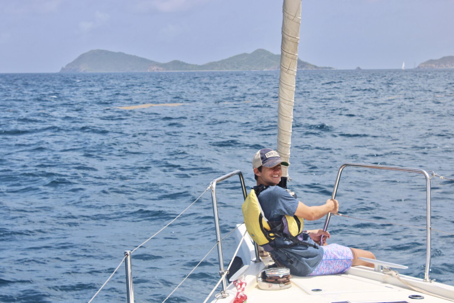 A man on a sailboat.