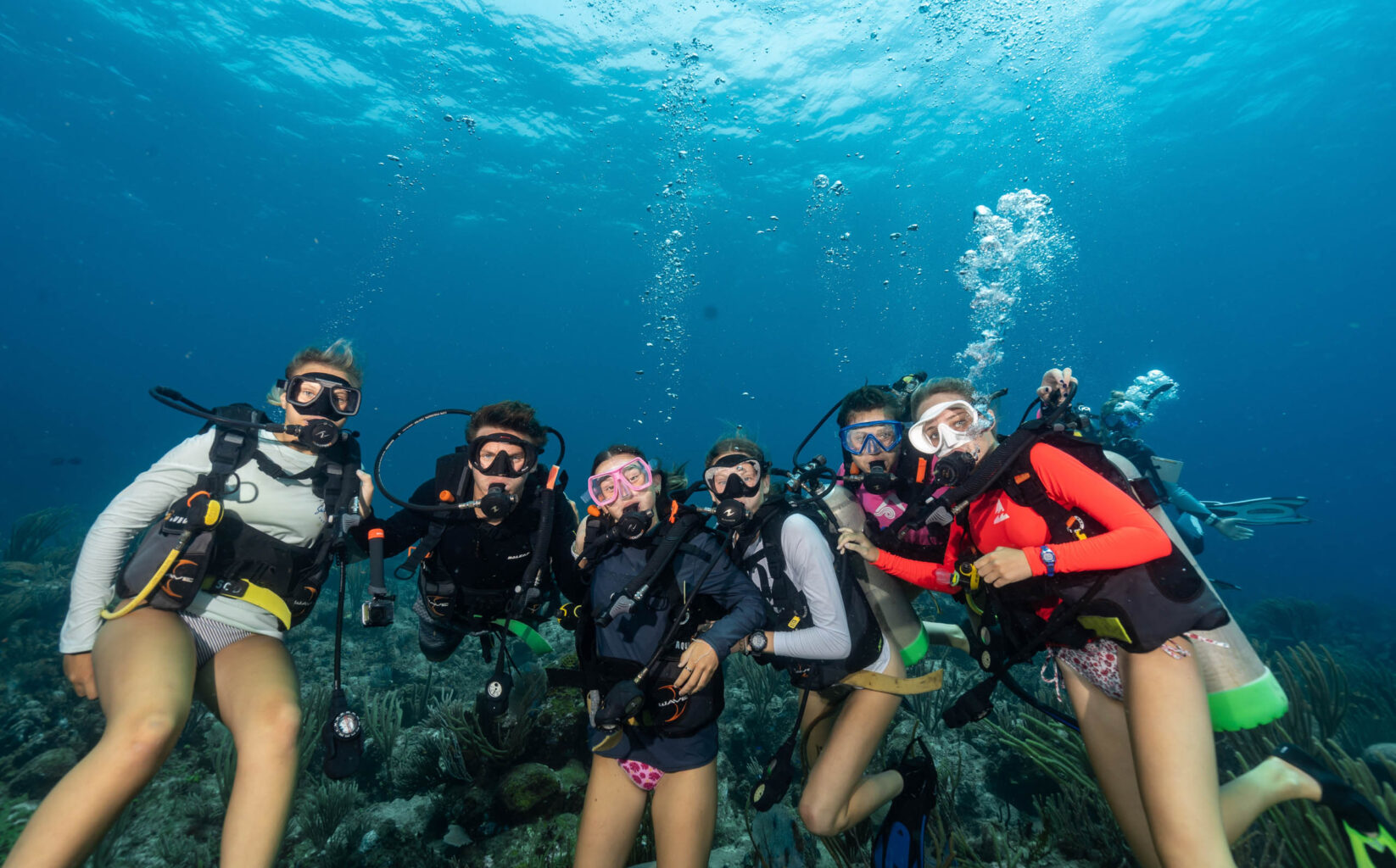 A group of scuba divers posing for a photo.